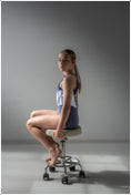 Carica l'immagine nel visualizzatore della galleria, A gymnast sitting on a chair in the Coco Leotard