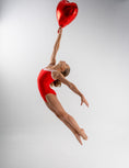 Carica l'immagine nel visualizzatore della galleria, A Picture of the Carina Leotard Jumping With a Balloon
