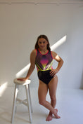 Load image into Gallery viewer, A gymnast standing in The Sunset One
